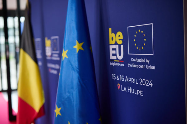 Event banner with Belgian presidency logo next to EU and Belgian flags